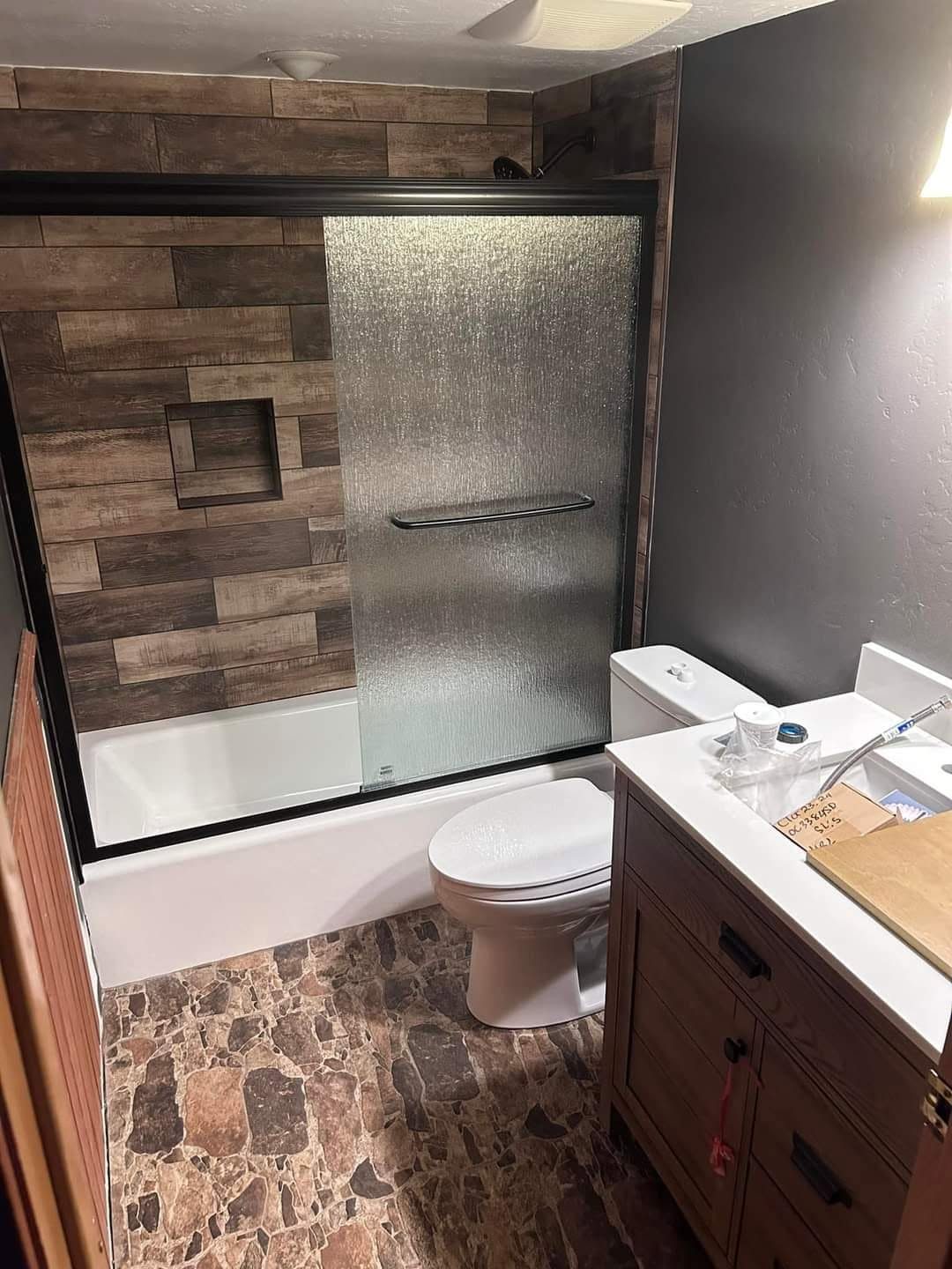 Finished bathroom remodel with a custom tile shower