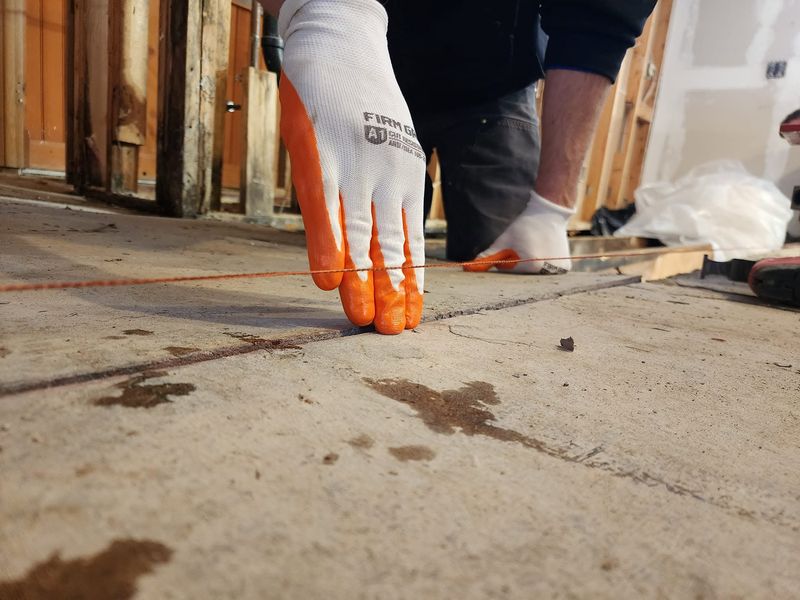 Interior showing an unlevel floor before structural correction